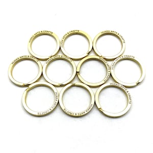 May include: Ten gold key rings with the text "HUKKA ARTS & CRAFTS" engraved on each ring.