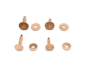 May include: Six rose gold metal rivets with a round head and a short shank. Each rivet is paired with a matching washer.