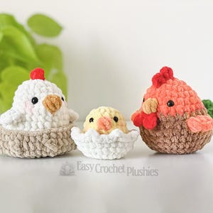 May include: Three crocheted plush chickens. A white chicken sits in a tan nest, a yellow chick peeks from a white eggshell, and a brown and orange chicken stands. The text "Easy Crochet Plushies" is at the bottom of the image.