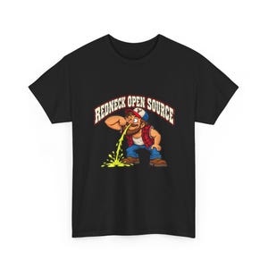 May include: A black short-sleeve t-shirt featuring a graphic of a bearded character in a red plaid shirt, blue jeans, and a cap, with the text REDNECK OPEN SOURCE arched above. The character is shown vomiting a bright yellow liquid onto the ground.