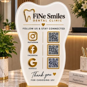 May include: A white, tooth-shaped acrylic sign with a gold base featuring the text Fine Smiles DENTAL CLINIC, social media icons for Instagram, Facebook, and Google, three QR codes, and the text FOLLOW US & STAY CONNECTED and Thank you.