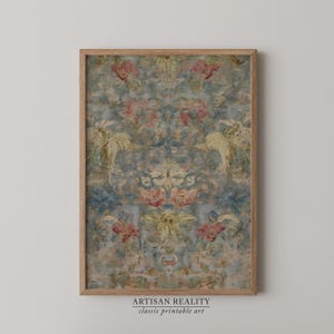May include: A framed print featuring a vintage floral pattern in shades of blue, pink, and yellow. The artwork has a distressed, aged appearance, with the text "ARTISAN REALITY classic printable art" at the bottom.