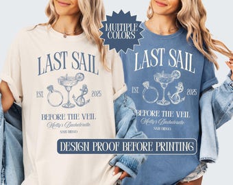 May include: Two t-shirts, one cream and one blue, with the text "LAST SAIL" and a graphic of a cocktail, ring, and anchor. The text "BEFORE THE VEIL" and "Molly's Bachelorette" are also printed on the shirts. The text "DESIGN PROOF BEFORE PRINTING" is also visible.