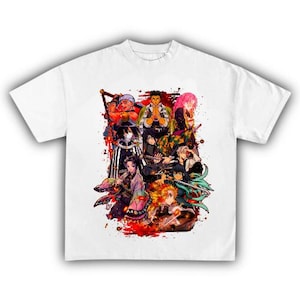 May include: White t-shirt featuring a colorful graphic of anime characters. The design includes multiple figures with various hair colors and outfits, set against a backdrop of red splatters. A casual, short-sleeved tee.