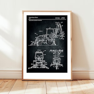 May include: Framed patent print of a tractor-loader backhoe. The black and white blueprint-style illustration shows detailed diagrams of the machinery, including side and front views. The text "United States Patent" and "TRACTOR-LOADER BACKHOE" are visible.