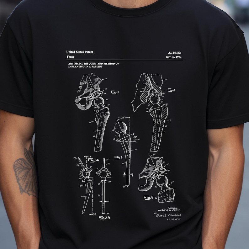 a man wearing a black t - shirt with a drawing of a hand holding a