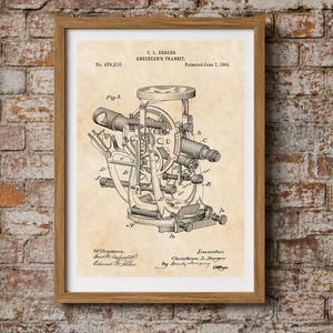 May include: A framed patent print on aged parchment paper featuring a technical drawing of a C. L. Berger engineer's transit, patent number 476,510, dated June 7, 1892. The black ink illustration shows the complex mechanical components.