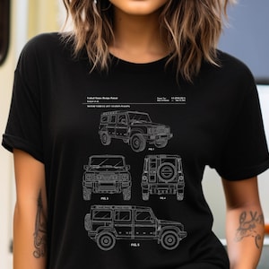 May include: A black short-sleeved t-shirt featuring a white graphic print of a United States Design Patent for a motor vehicle. The design includes technical line drawings of a station wagon from multiple angles, labelled Fig. 1, 3, 4, and 5.