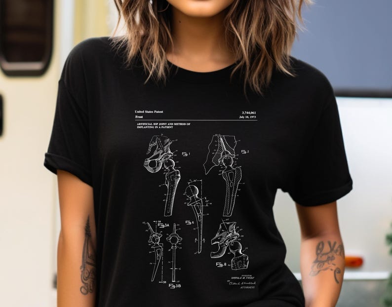 a woman wearing a black t - shirt with a drawing of a woman's