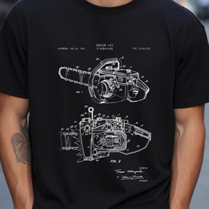 a man wearing a black t - shirt with a drawing of a camera on it