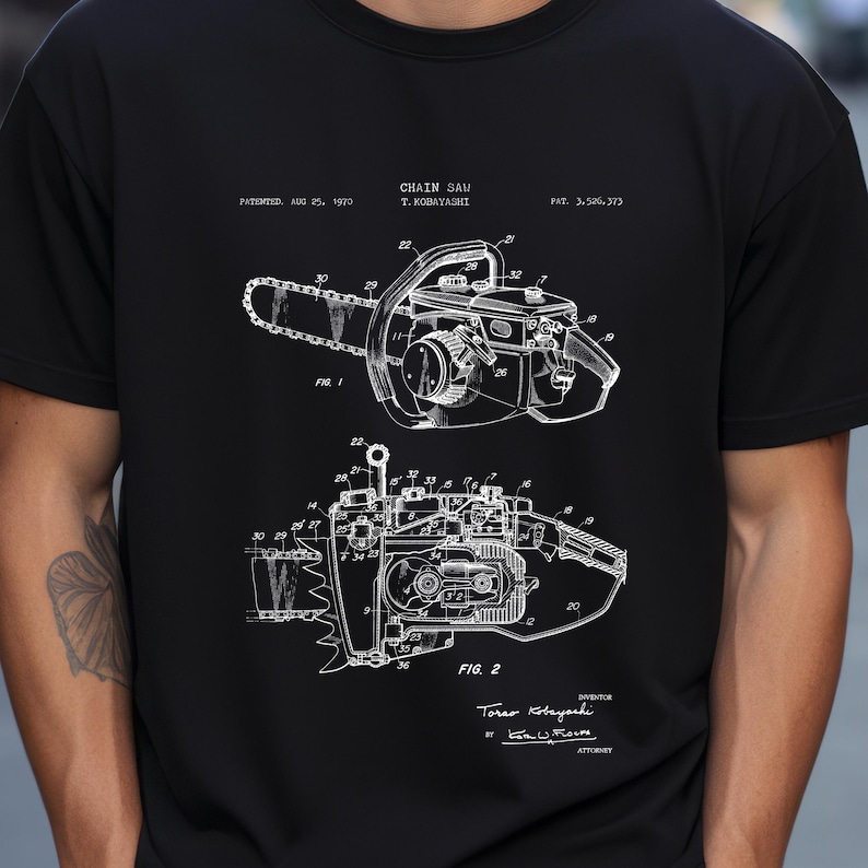 a man wearing a black t - shirt with a drawing of a camera on it