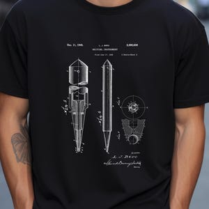 May include: A black and white illustration of a patent for a writing instrument, showing the design of a pen. The patent is titled "Writing Instrument" and was filed on June 17, 1943, by L.J. Biro. The patent number is 2,390,636.