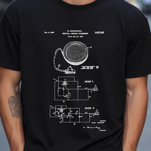 Könnte beinhalten: Schwarzweißes Patentzeichnung eines medizinischen Herzschrittmachers mit dem Text "W. GREATBATCH MEDICAL CARDIAC PACEMAKER Filed July 22, 1960 3,057,356" oben.