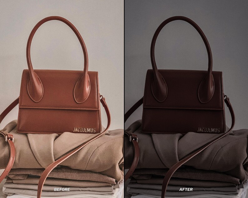 May include: A brown leather handbag with a structured design, featuring a top handle and a shoulder strap. The bag is placed on top of folded clothing. The brand name "JACQUEMUS" is visible on the front.