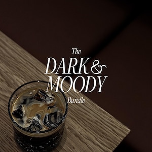 May include: A glass of iced coffee with ice cubes, on a wooden surface. The text "The Dark & Moody Bundle" is displayed in white script. The background is a dark brown color.