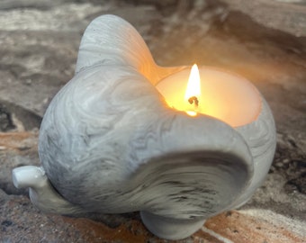 Candle in a pot in the shape of an elephant