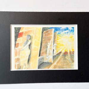 May include: Watercolor painting of a sunlit architectural scene with figures. The artwork features brick walls, statues, and a bright yellow and blue sky. The painting is matted in white and framed in black.