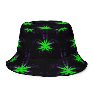 May include: A black bucket hat featuring a repeating pattern of bright neon green leaf-shaped graphics with dark purple accents. The hat has a rounded crown and a downward-sloping brim, showcasing a consistent print across the entire fabric surface.