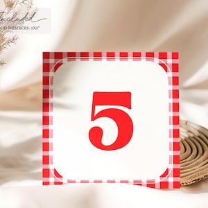 May include: Red and white gingham table number card with the number 5 in red.
