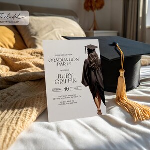 May include: A white graduation party invitation with black text. The invitation features a black and white illustration of a graduate wearing a cap and gown. The text reads "Please join us for a Graduation Party Honoring Ruby Griffin Saturday 16 June The Falcon Residence 88 Fairy Way, Santa Barbara, Ca Kindly RSVP to Rachel 123-456-789"