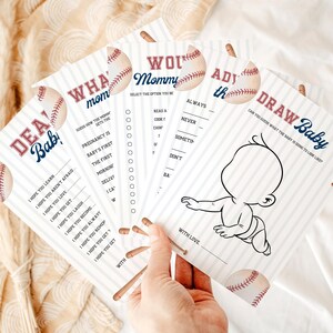 Peut inclure: Ensemble de cartes de jeu pour une baby shower sur le th&egrave;me du baseball. Les cartes pr&eacute;sentent des graphiques de baseball et du texte comme "Dear Baby" et "Draw Baby". Les cartes sont blanches avec du texte bleu et rouge.