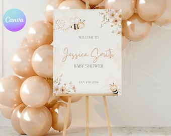 May include: A welcome sign for a baby shower with a bee and floral design. The sign says "Welcome to Jessica Smith Baby Shower July 4th 2024".