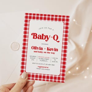 May include: Red and white gingham baby shower invitation with the text "Join us for a Baby-Q honoring Olivia + Kevin and baby on the way". The invitation includes details for the event, including the date, time, location, and RSVP information. It also mentions that the couple is registered at Target and Amazon.