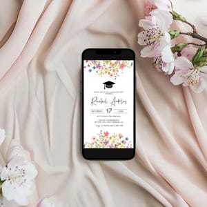 May include: A smartphone displaying a graduation party invitation with a floral design. The invitation reads "Rachel Ackles, Saturday, June 17, at 2 o'clock in the afternoon, The Tea Room, 1234 Main Street, Santa Barbara, CA, RSVP to Rachel at 555-456-7890".