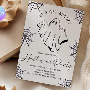 May include: A white rectangular Halloween party invitation card featuring a black line drawing of a ghost in the center, surrounded by purple spider webs. The text reads: LET'S GET SPOOKY, PLEASE JOIN US FOR A Halloween Party, FRIDAY - OCTOBER 15TH - AT 3PM, PUMPKIN DRIVE 3145, DENVER, FLORIDA, 11097, KINDLY RSVP TO ANNA AT 1236979325.