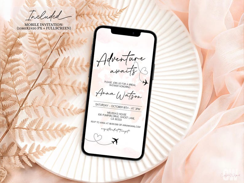 May include: A mobile invitation on a smartphone, featuring the text "Adventure awaits" with a heart and airplane graphic. The invitation is for a bridal shower honoring Anna Watson, with date, time, and location details. The phone rests on a white plate with a soft pink background.