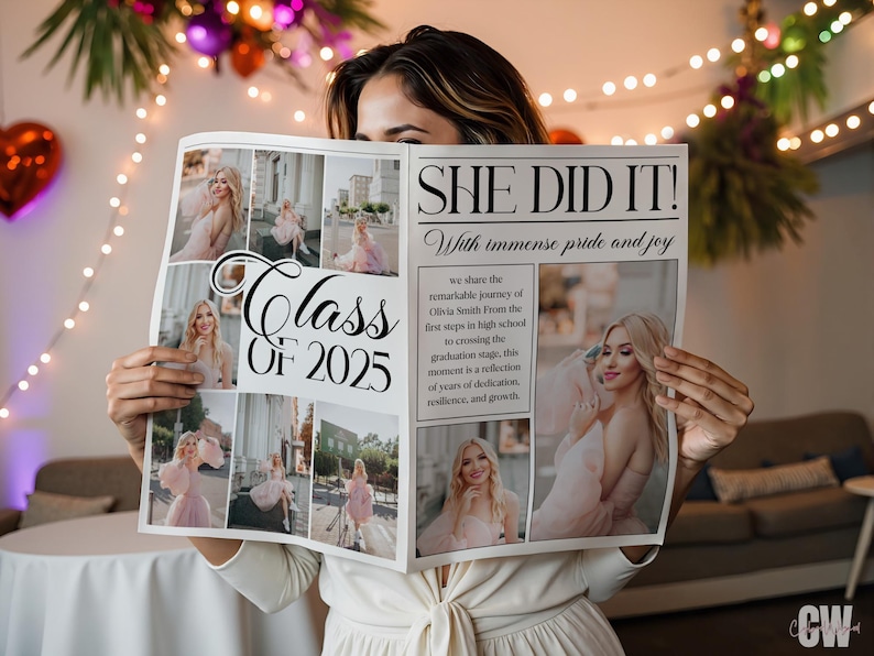 May include: A person holding a newspaper with the headline "SHE DID IT!" and the text "Class of 2025." The newspaper features photos of a woman in a pink dress. The background includes decorative lights and a table.