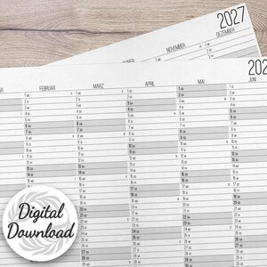 May include: A 2027 wall calendar printed on white paper with black text and gray shaded rows. The calendar displays months from January to June in a linear format. A circular white sticker with the black text Digital Download is visible.