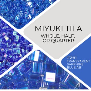 May include: A close-up of blue Miyuki Tila beads. The beads are available in whole, half, or quarter sizes. The beads are labeled #261 Transparent Sapphire Blue AB.