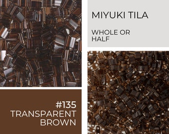 May include: A close-up image of brown transparent Miyuki Tila beads. The beads are small and square shaped. The text on the image reads "#135 TRANSPARENT BROWN" and "MIYUKI TILA WHOLE OR HALF".