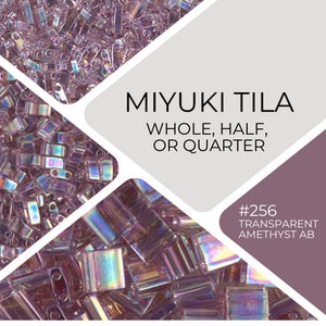May include: A close-up of a pile of iridescent purple Miyuki Tila beads. The beads are available in whole, half, or quarter sizes. The text "#256 TRANSPARENT AMETHYST AB" is visible in the image.