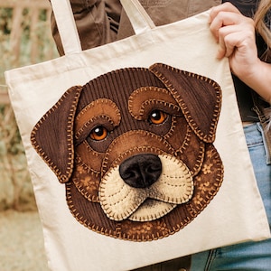Peut inclure: Sac fourre-tout crème avec une applique cousue détaillée d'un visage de chien. Le visage du chien est brun, beige et crème, avec des yeux orange et un nez noir. Le sac a deux anses crème.