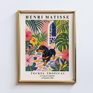 May include: A framed art print featuring a black and tan dachshund standing on a colorful tiled floor surrounded by tropical plants and flowers. The text reads HENRI MATISSE, TECKEL TROPICAL, Le Cateau-Cambrésis, and 31 Décembre 1869 in black font.