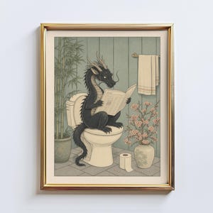 May include: Framed print showing a black dragon reading a newspaper while seated on a toilet. The bathroom scene includes a bamboo plant, a vase of flowers, and a roll of toilet paper. The artwork has a humorous and whimsical theme.