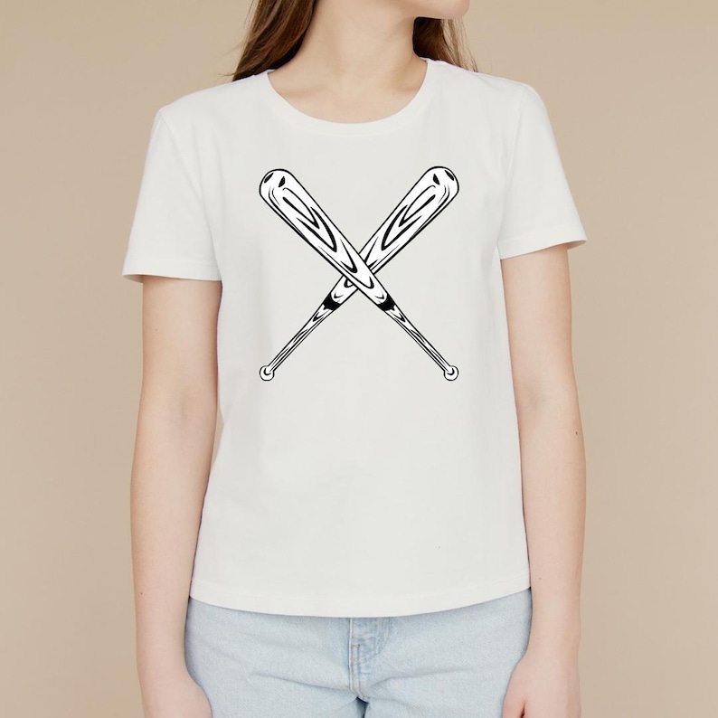 May include: White t-shirt with a black graphic of two crossed baseball bats.