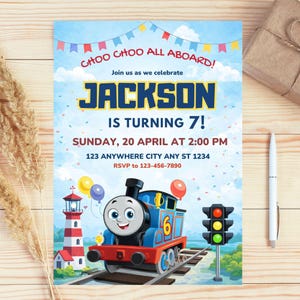 May include: A birthday invitation with a train theme. The invitation reads "CHOO CHOO ALL ABOARD!" and "JACKSON IS TURNING 7!" The design includes a cartoon train, a lighthouse, and a traffic light, all set against a blue sky background.