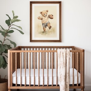 Vintage watercolor illustration art print of a teddy bear playing football. Football theme nursery art. Sports nursery decor. Nursery inspiration. Nursery ideas. Vintage nursery art. Kids room sports art. Football kids room art. Playroom football.