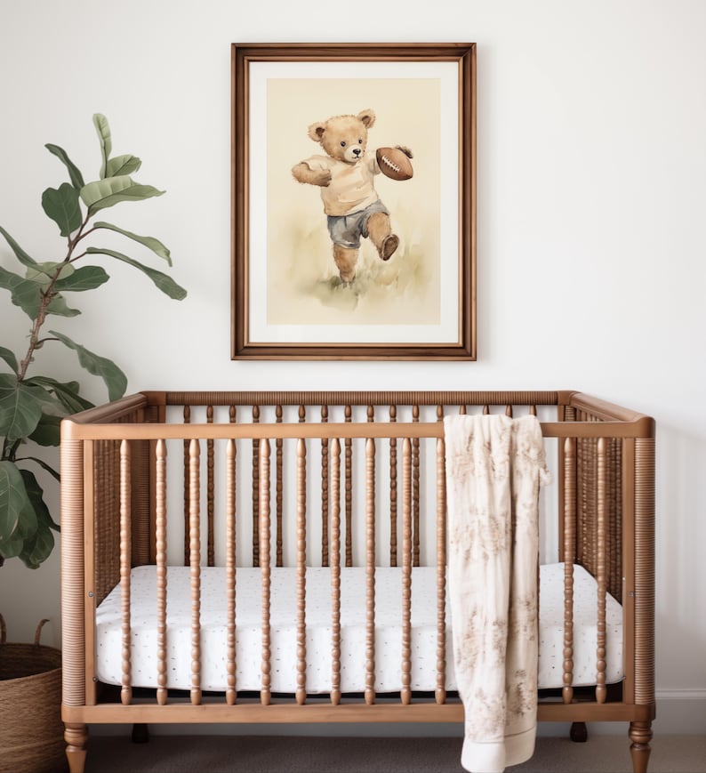 Vintage watercolor illustration art print of a teddy bear playing football. Football theme nursery art. Sports nursery decor. Nursery inspiration. Nursery ideas. Vintage nursery art. Kids room sports art. Football kids room art. Playroom football.
