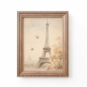 Vintage watercolor illustration art print of a bow, Eiffel Tower, and a tea cup. Coquette nursery decor. Bow art for nursery. French nursery art. Nursery inspiration. Nursery ideas. Vintage nursery art. Baby girl bow art. Paris kids room art.