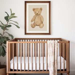 Watercolor illustration art print of brown teddy bear in a wood frame above a crib. Teddy bear downloadable print art. Teddy printable art. Nursery inspiration. Nursery ideas.