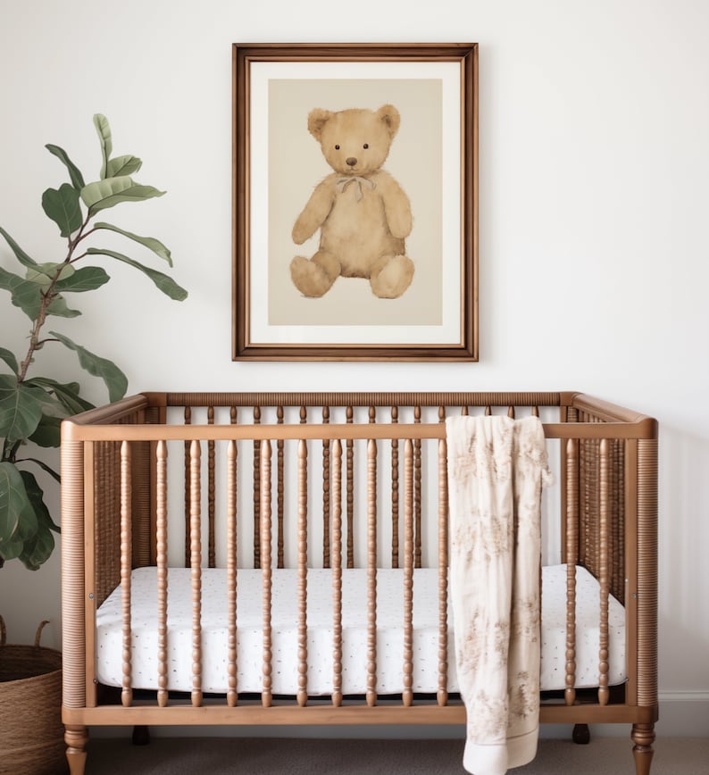 Watercolor illustration art print of brown teddy bear in a wood frame above a crib. Teddy bear downloadable print art. Teddy printable art. Nursery inspiration. Nursery ideas.