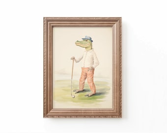 May include: A framed watercolor painting of an alligator wearing a blue hat and red and white plaid pants, holding a golf club. The alligator is standing on a green golf course.