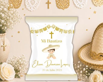 May include: A white rectangular snack bag with gold accents featuring a graphic of a child in a sombrero, a gold cross, and the text Mi Bautizo, Elian Damian Lopez, and 20 de Julio 2024. The design includes gold bunting and decorative elements.