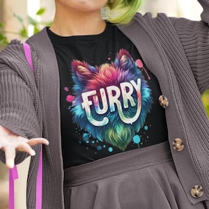 May include: Black t-shirt with a colorful furry animal head graphic and the word "FURRY" written in white letters.