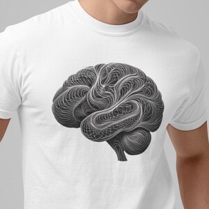 Può includere: Maglietta bianca con una grafica in bianco e nero di un cervello. Il cervello è stilizzato con una rete di linee.
