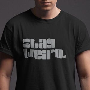 Stay Weird Graphic Tee: Unisex Softstyle T-Shirt